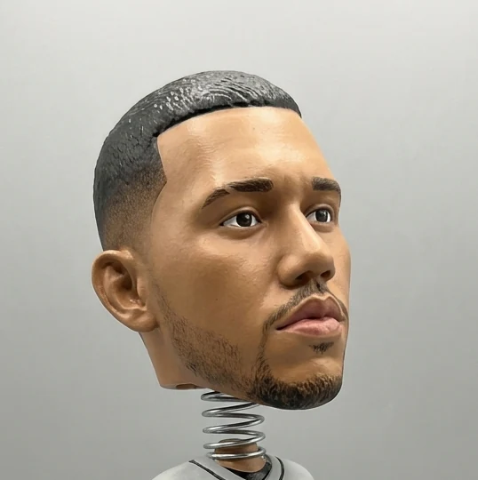 Tæt udsnit af en bobblehead-makerfigurs store hoved på fjederen, lille nok til en profilavatar